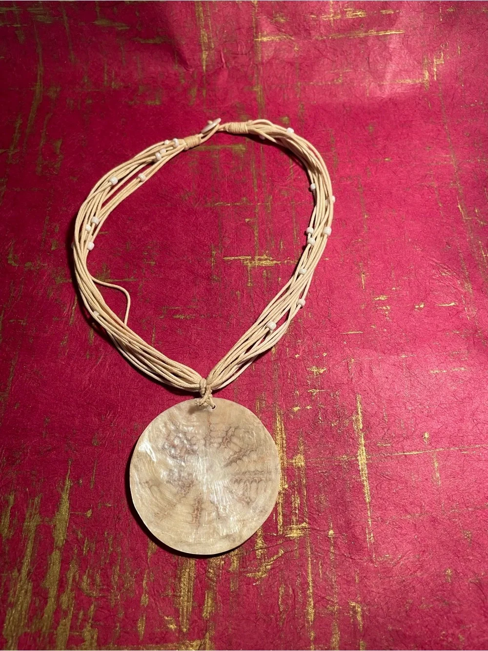 Handcrafted Cream Multi-Strand Necklace with Round Pendant